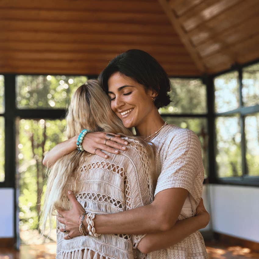 charismatic woman offering support to woman