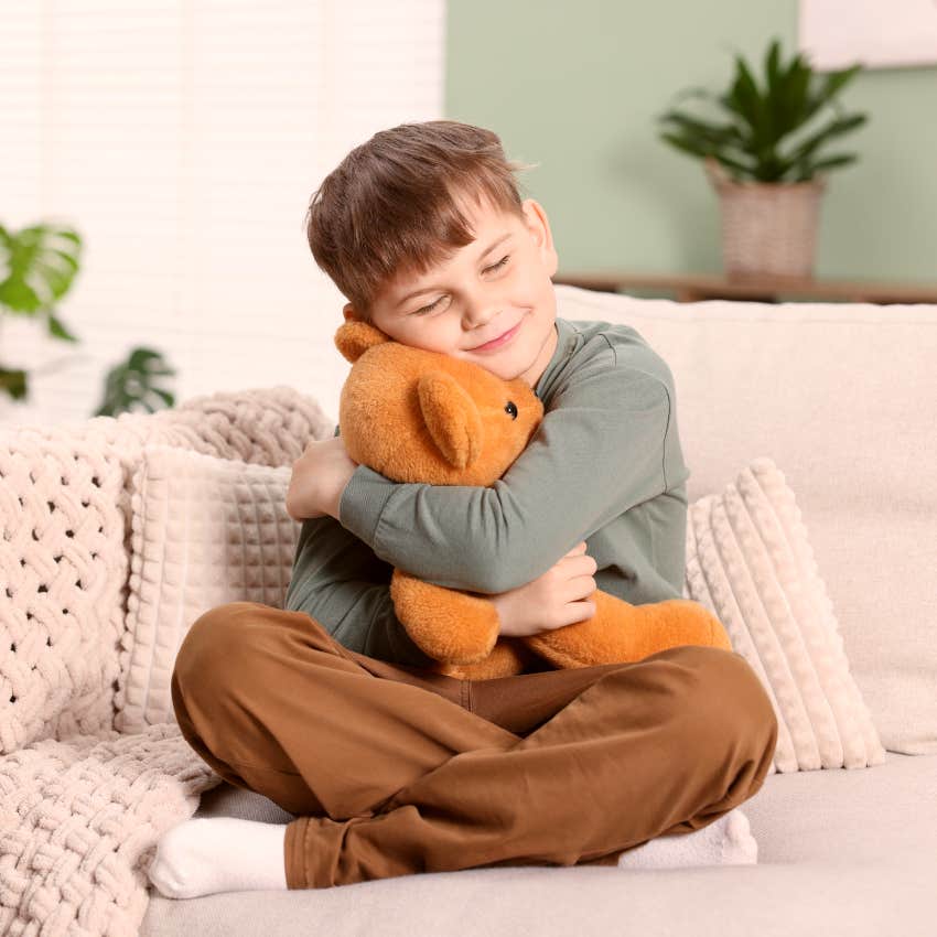 young boy attached to his childhood toy