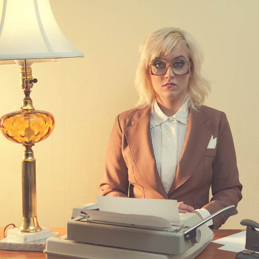 Vintage woman typing a paper