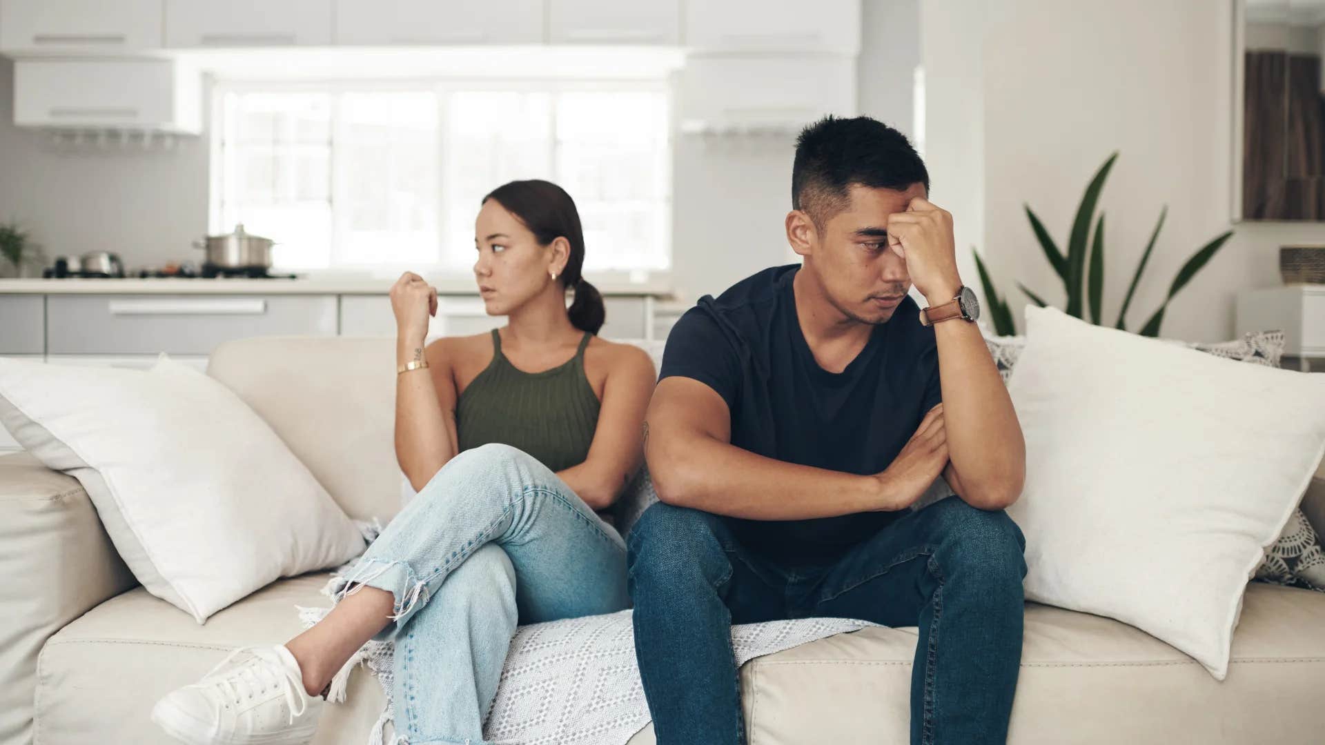 unhappy couple seated next to each other thinking their distance is just a phase