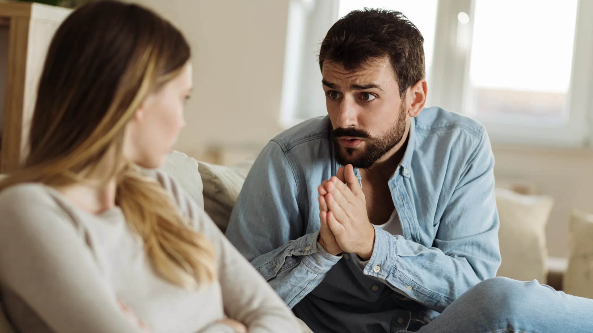 man telling his partner it's not time to move on trying to save his relationship