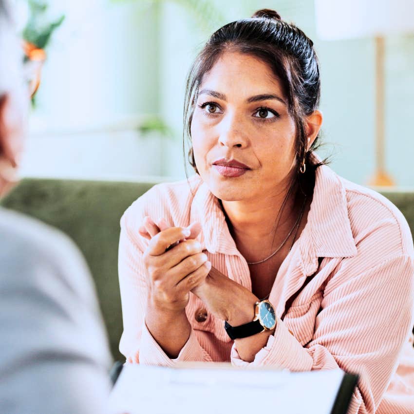 Woman saying "I'll be available still" to her boss at work.