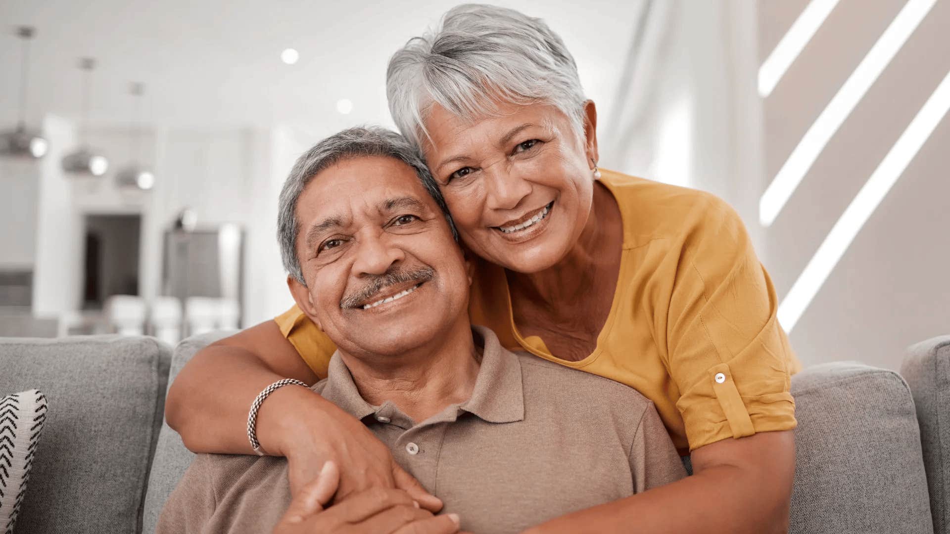 emotionally intelligent parents smiling hugging each other