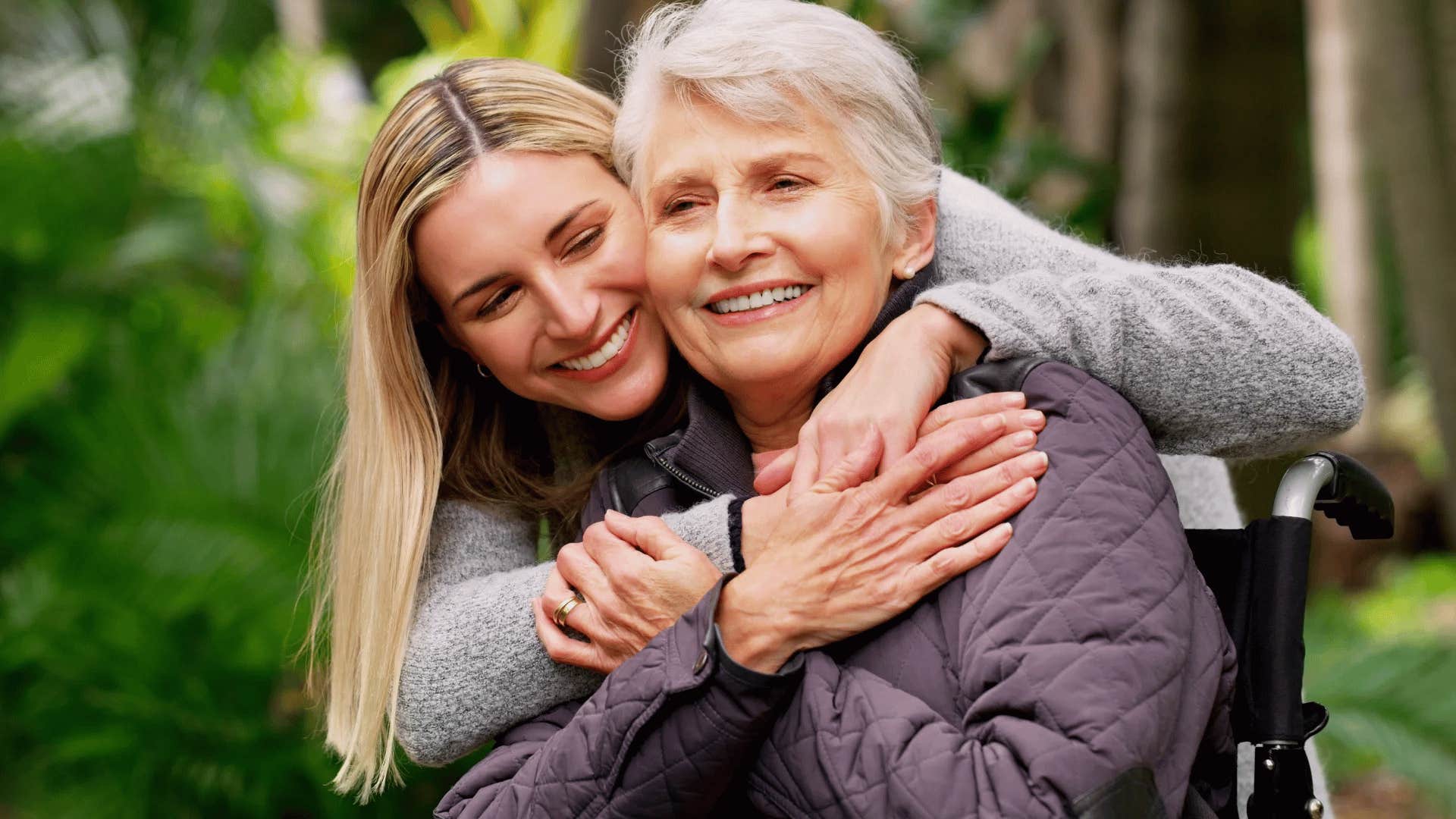 mother and daughter hugging smiling