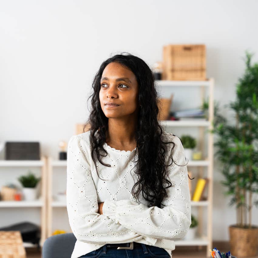 anxious woman with arms crossed who needs alone time to function
