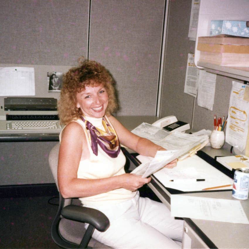 woman working as an administrative assistant in the 1980s happy to have it as a first job