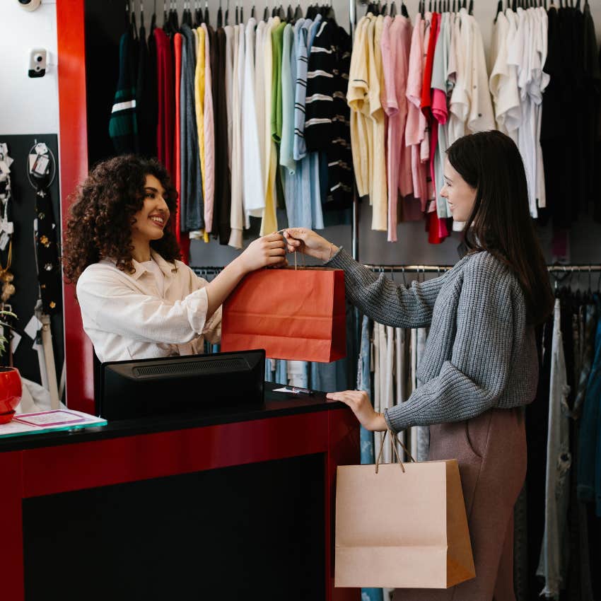 woman happily working retail job Gen Z won't even apply to