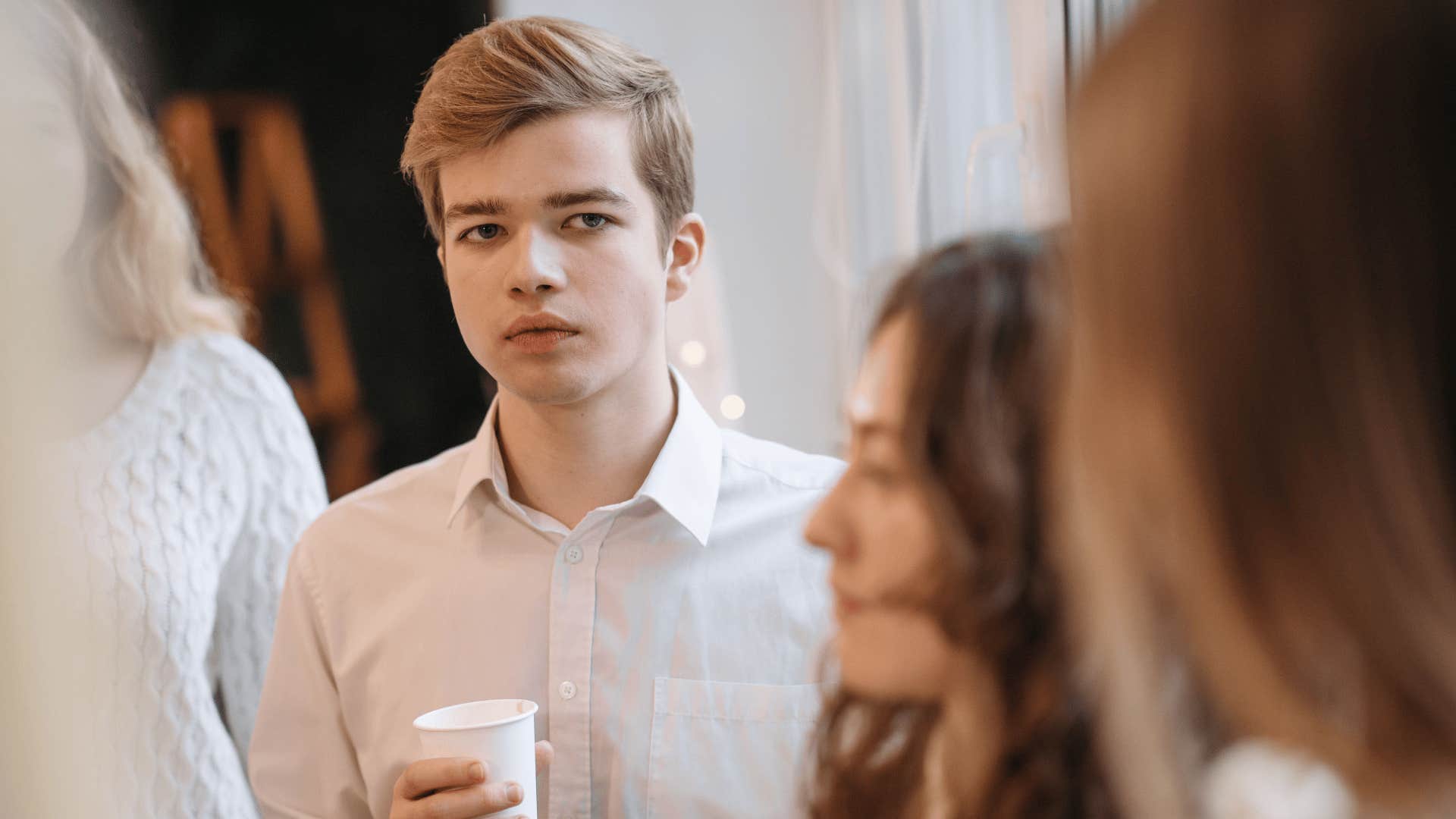 gen Z man feeling stressed trying to network with others