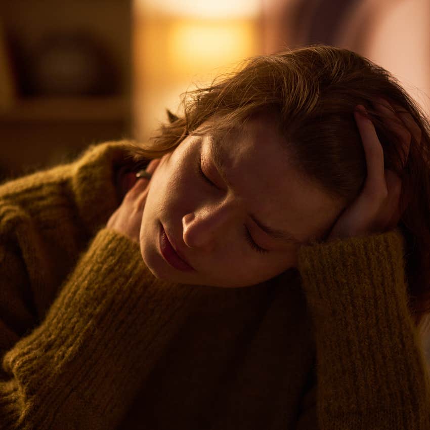 Female empath speaking out loud to herself at home