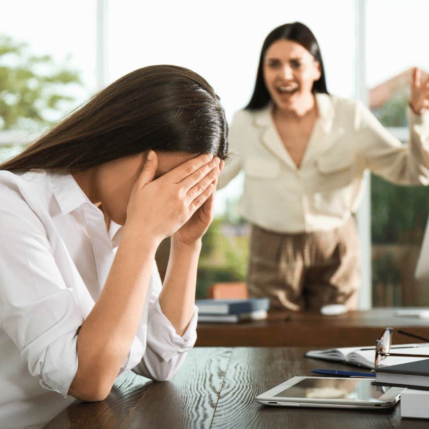 frustrated woman listening to woman complain loudly