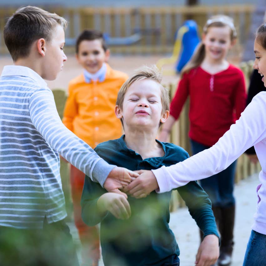 group of kids playing Red Rover outside