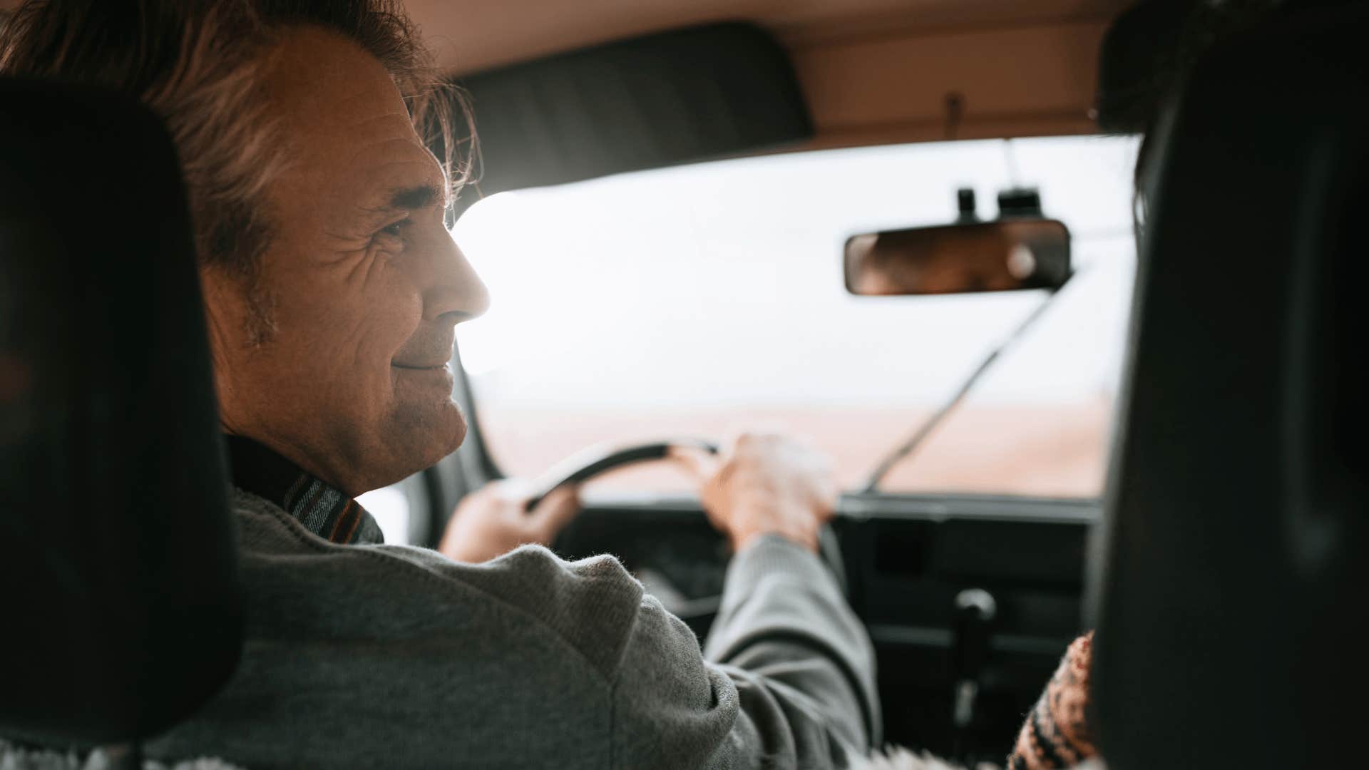 gen X man driving home after leaving an event early
