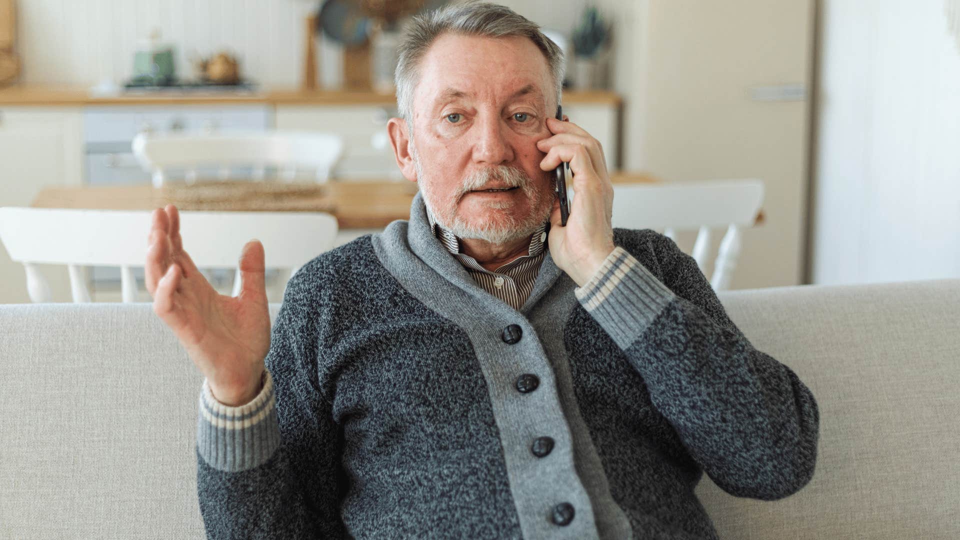 man on the phone arguing because he didn't answer right away