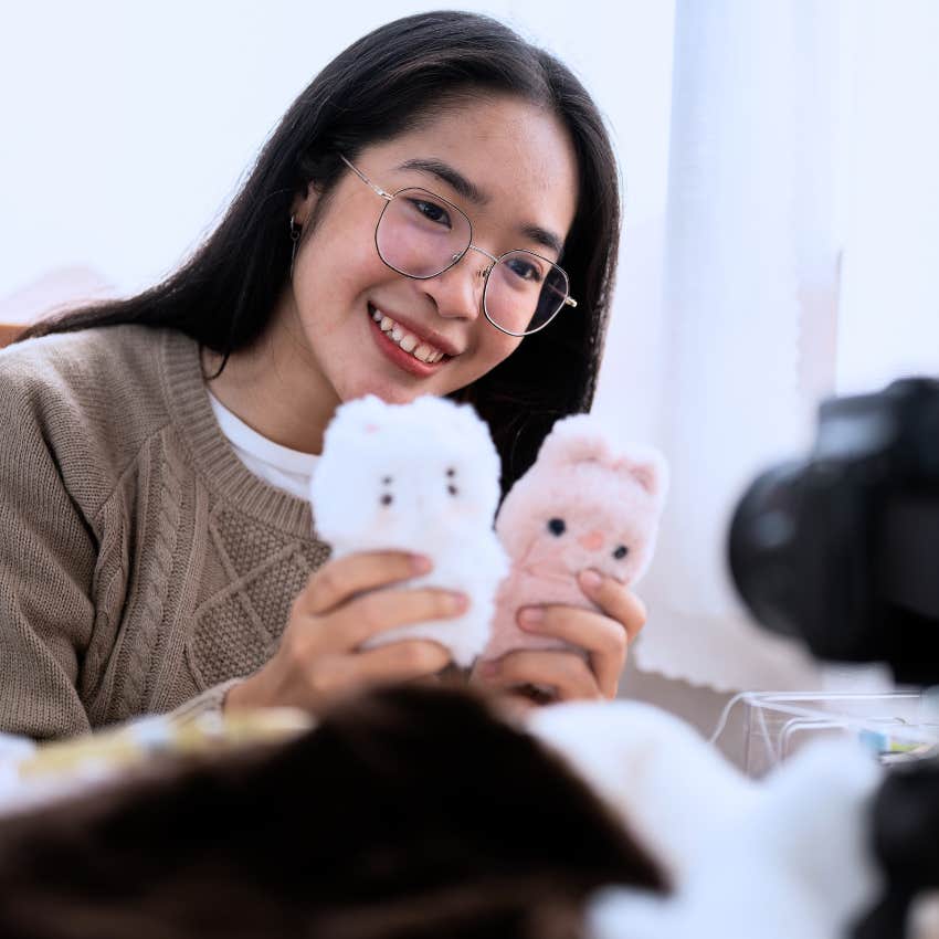 Gen Z woman with her plushies and stuffed animals