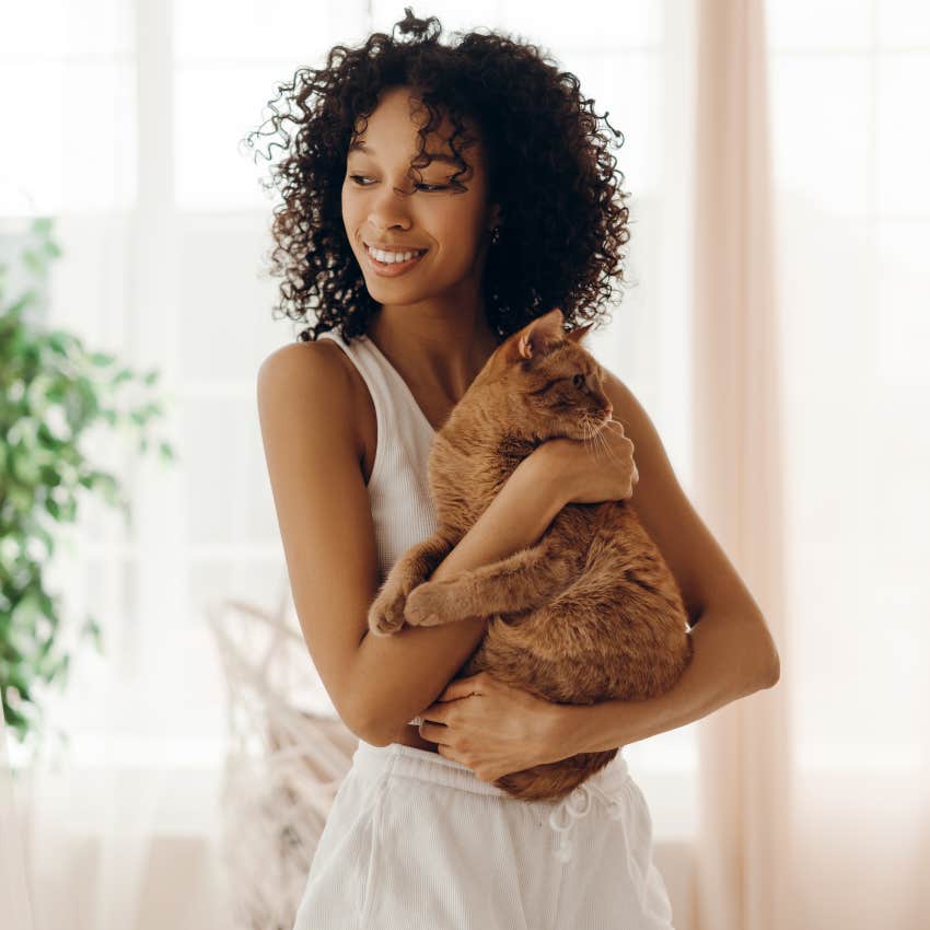 gen z woman with her pet cat