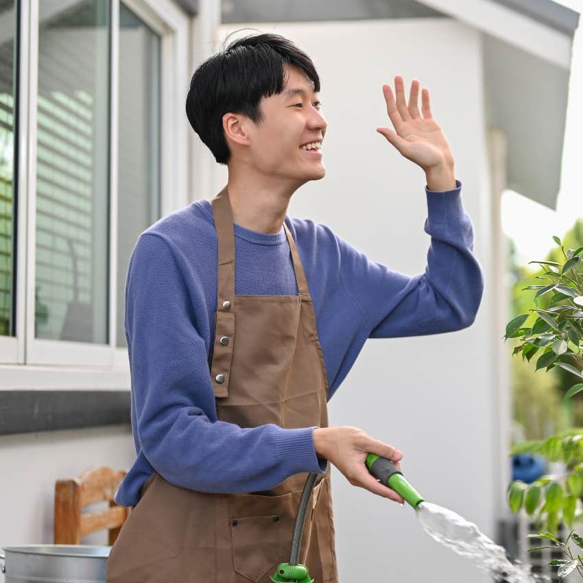 happy gen Z man being mindful while waving at neighbor