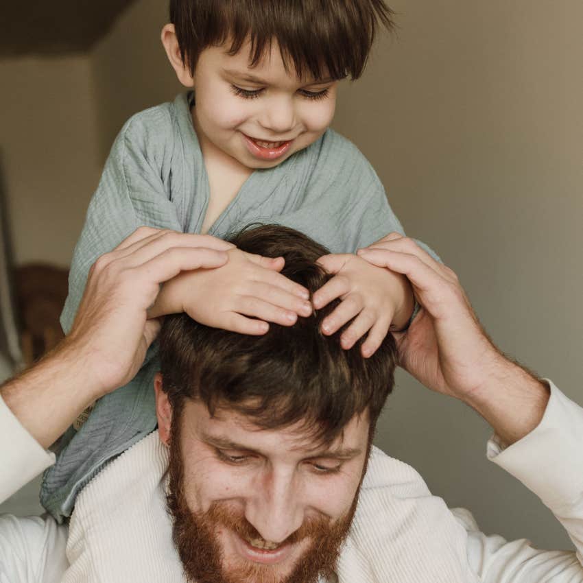 gen z dad blending warmth and authority giving piggyback ride