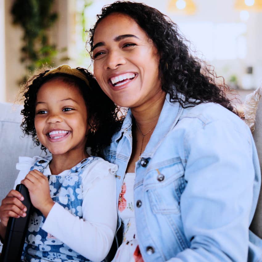 Gen Z woman holding her daughter but not making motherhood her identity
