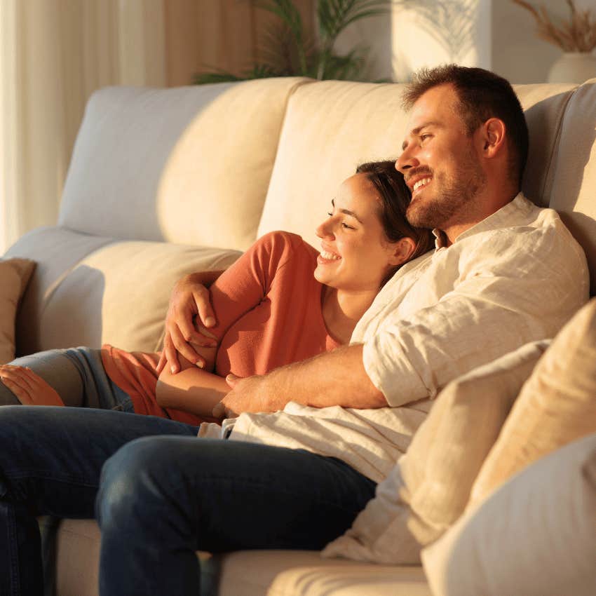 happy couple relaxing on a couch together