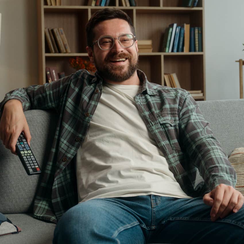 man who likes a small circle and staying home enjoying watching a movie on the couch
