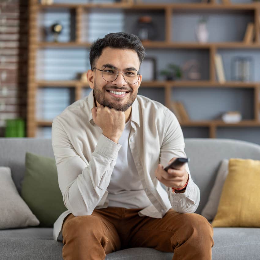 high-strung man watching comfort tv show in his living room to calm down fast
