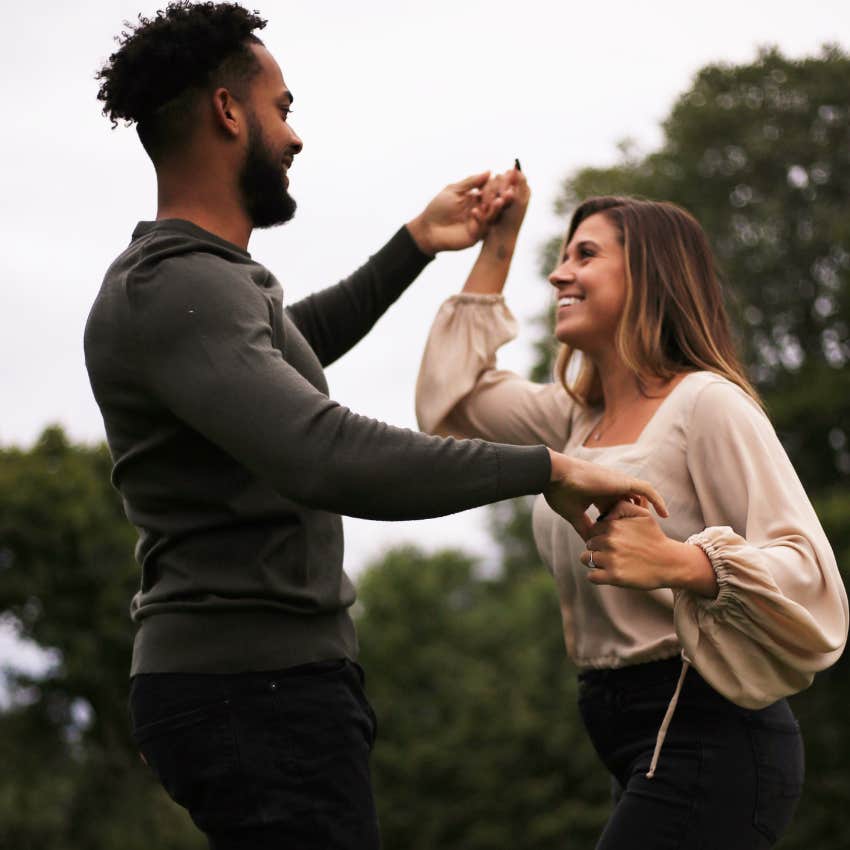 happy couple dancing together for fun