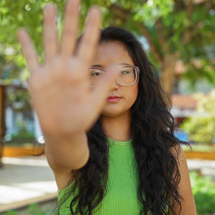 gen z woman firmly setting boundaries