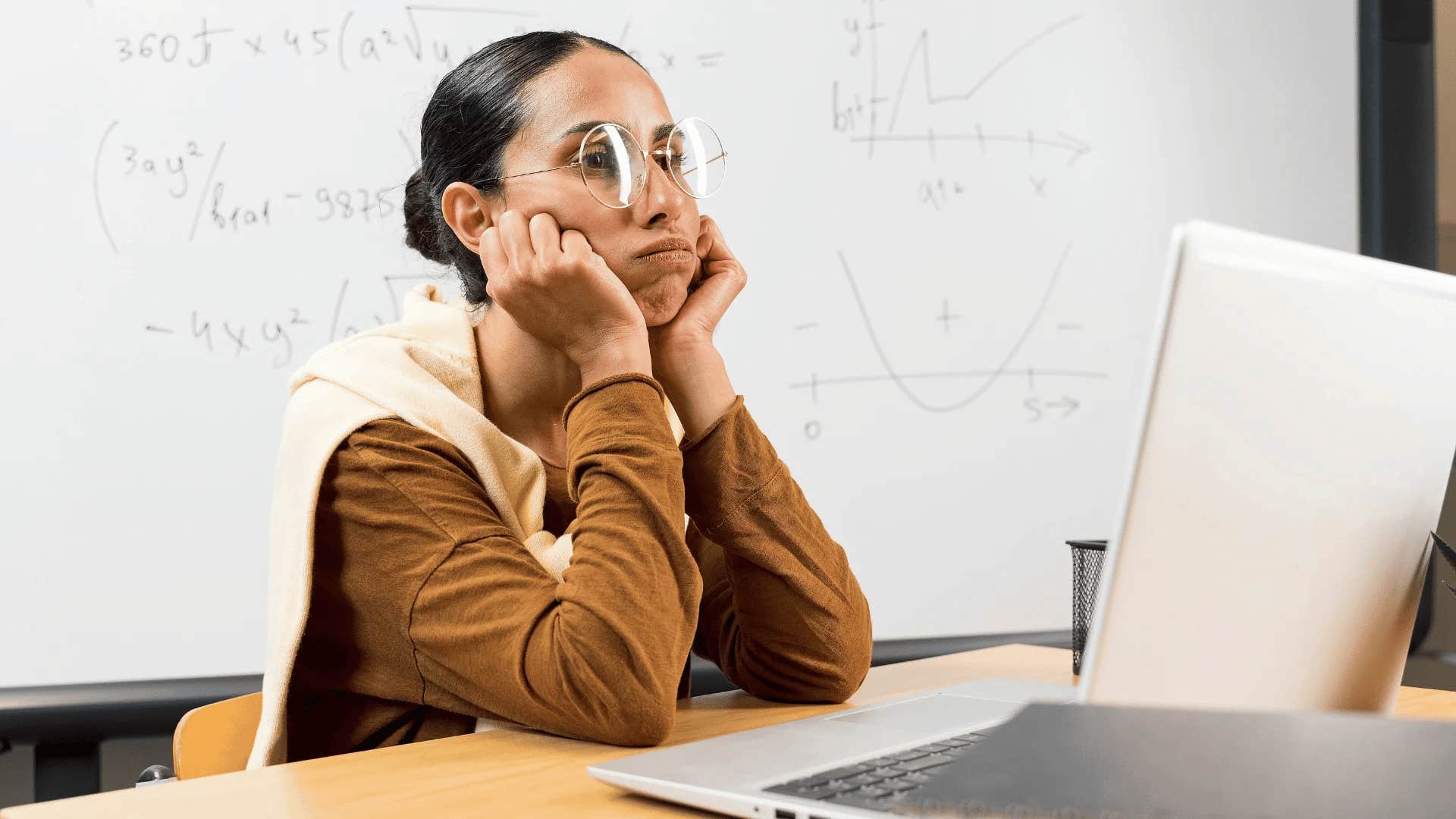 frustrated young woman fearing failure while studying