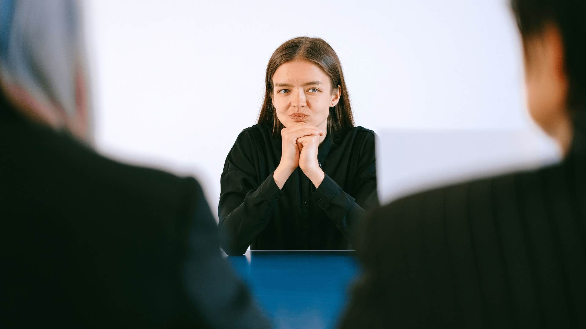 woman trying to negotiate with her bosses at work