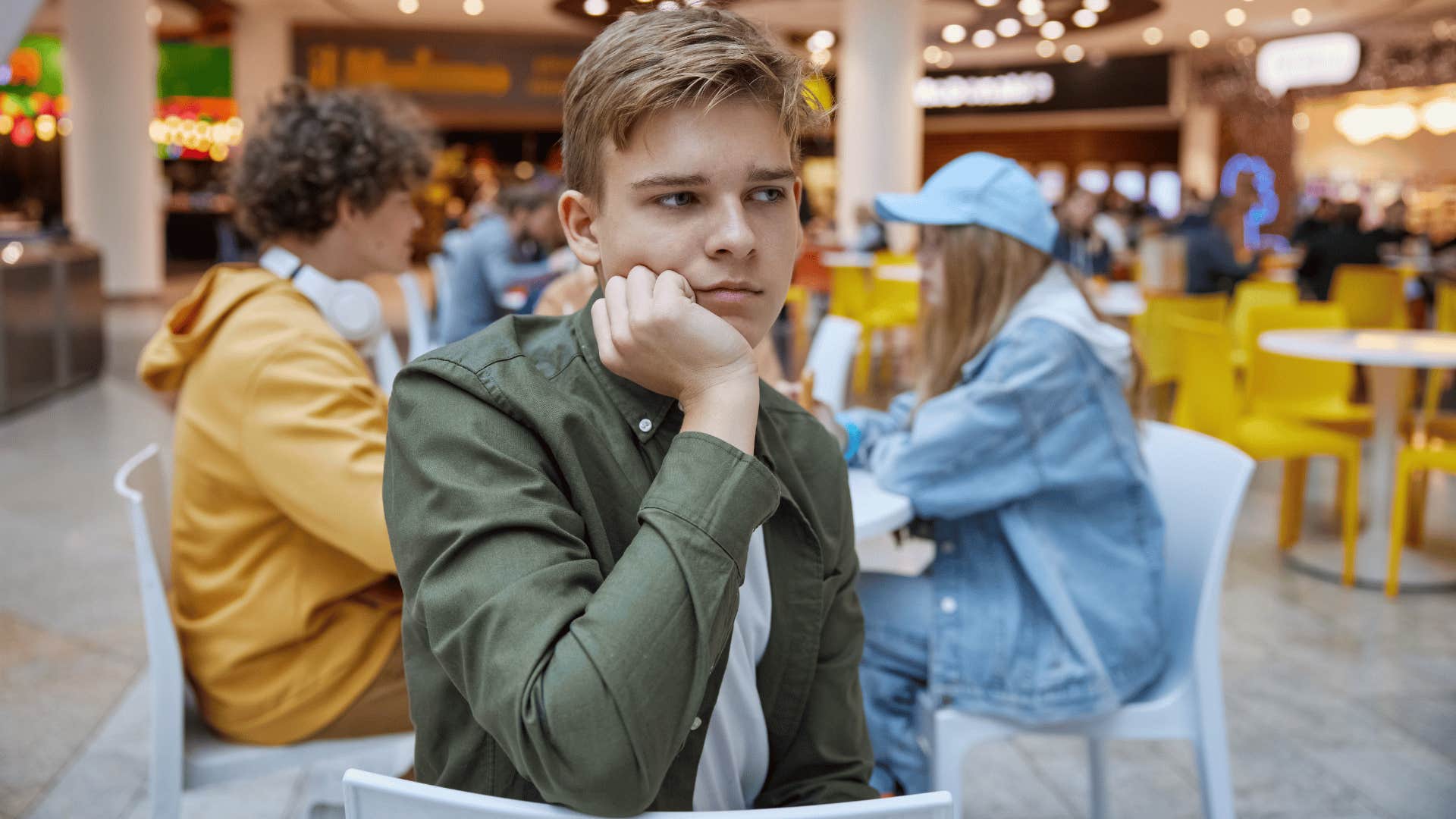 kid pouting at the mall saying not fair he didn't get his way