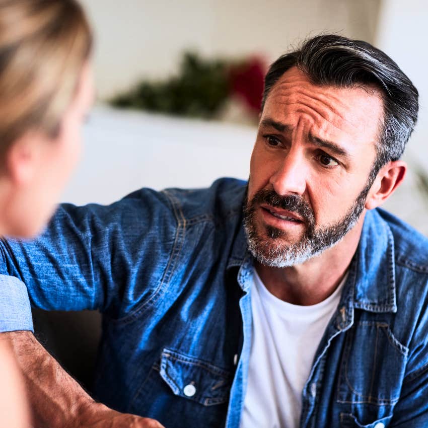insecure man over-apologizing at home to his partner
