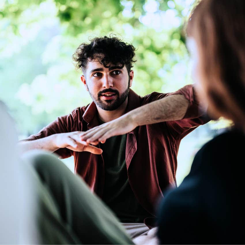 Man who oversteps in group conversations talking to friends.