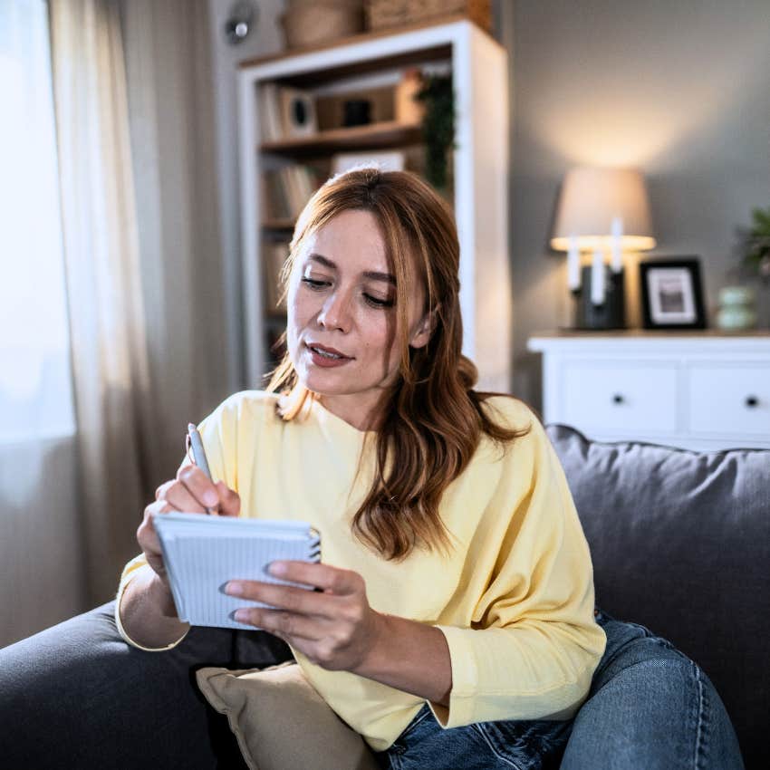 woman who's become a planner writing in her calendar
