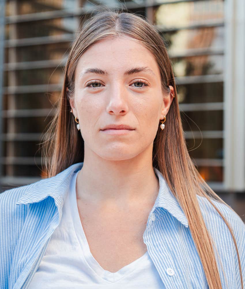Woman who was raised by parents with no social life standing alone 
