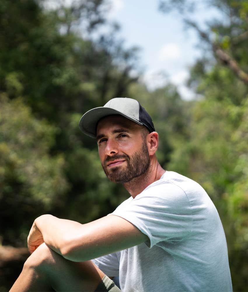 Man raised by parents with no social life sits outside as an introvert 