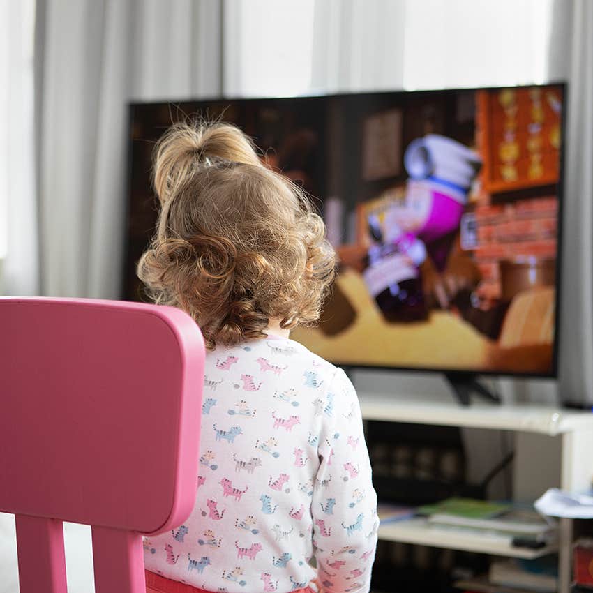 little girl watching television