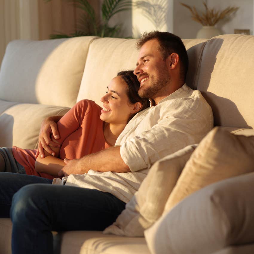 couple cuddling on the couch feeling safe together