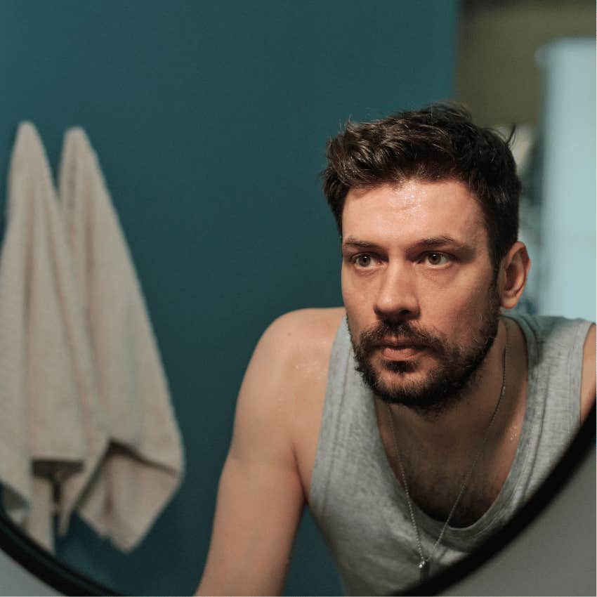 man not recognizing himself in mirror