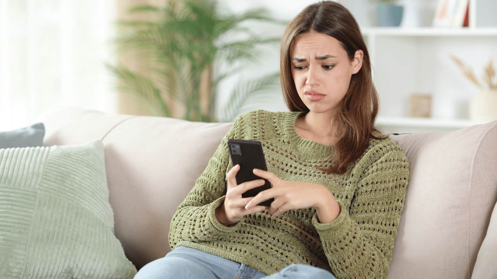 annoyed woman noticing someone lying on text message