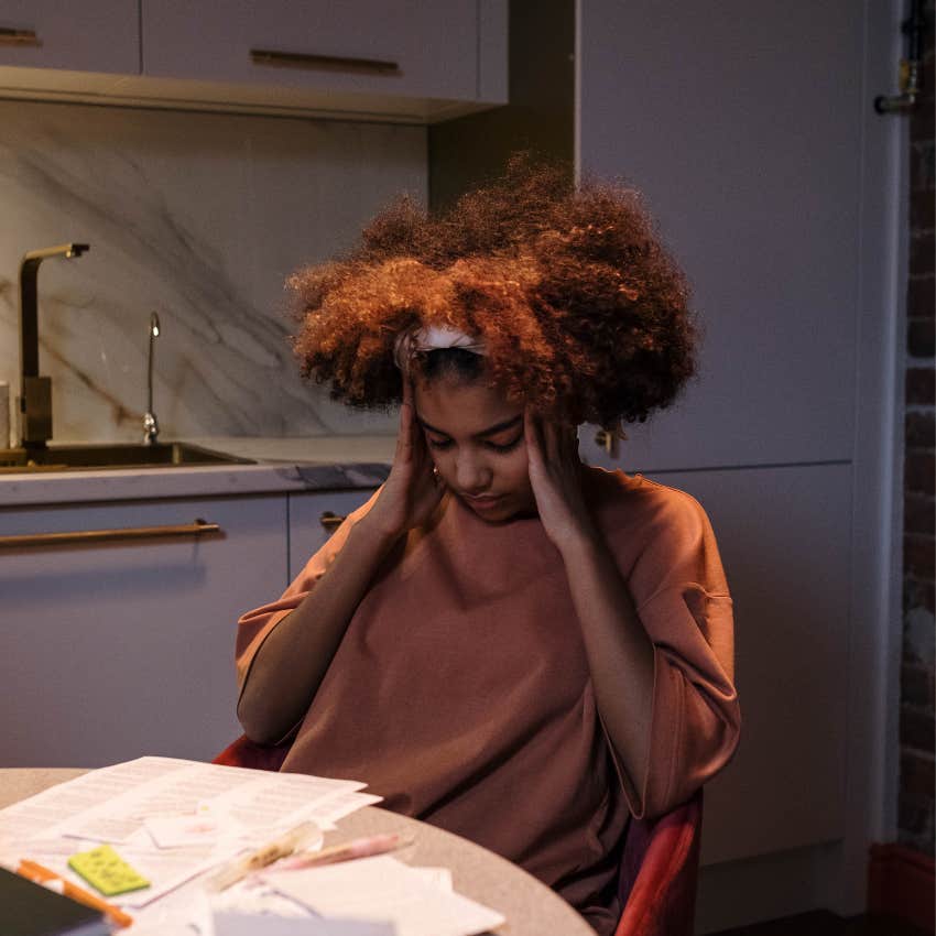 checked out woman sitting at home saying she's just tired