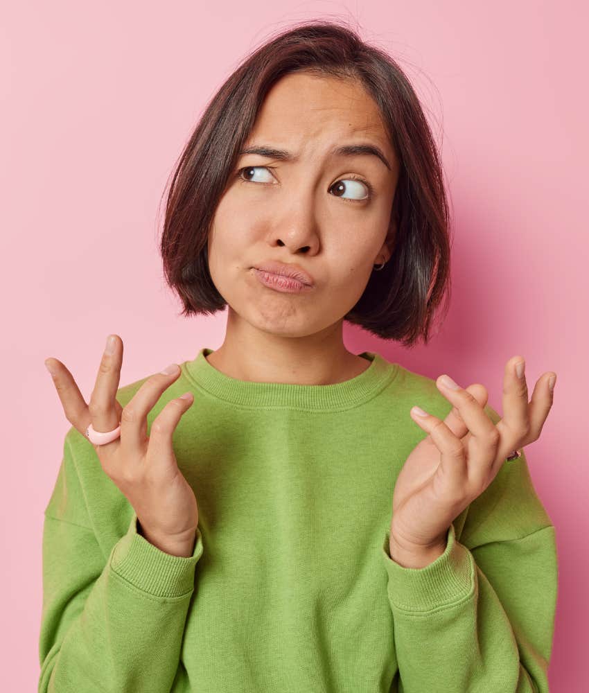 Emotionally childish adult woman shrugs because she said what she said