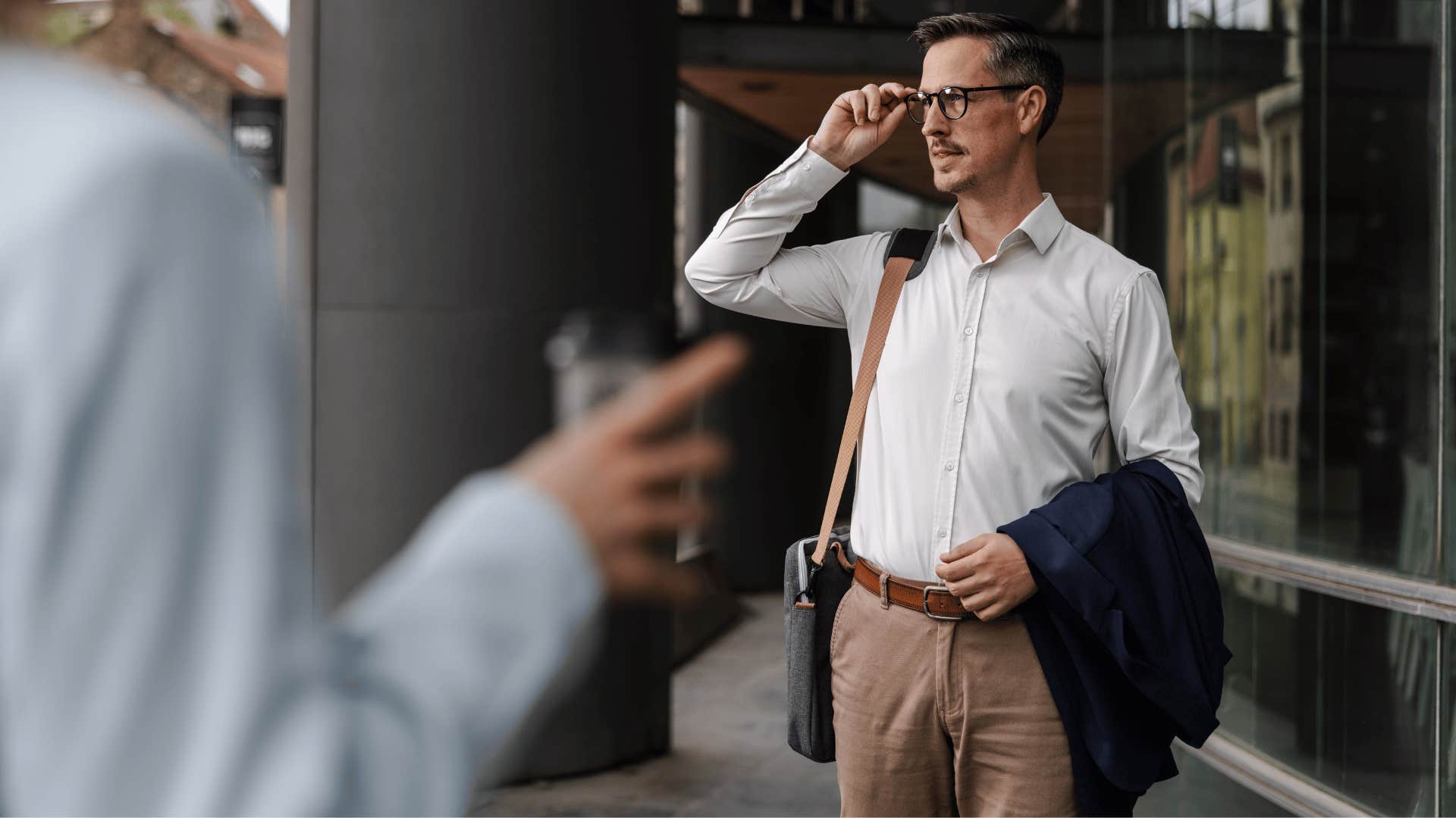 man noticing changes that others miss standing outside