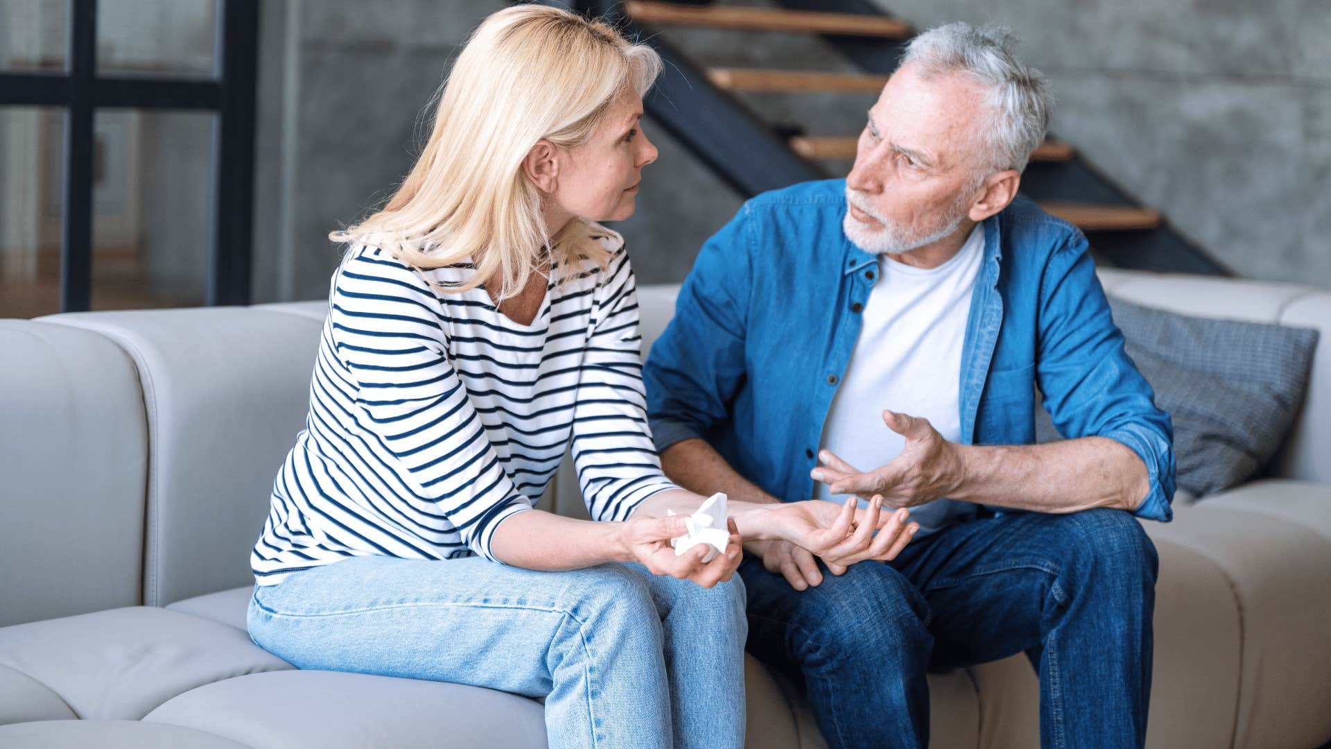 couple on couch turning simple disagreements into deep conversations