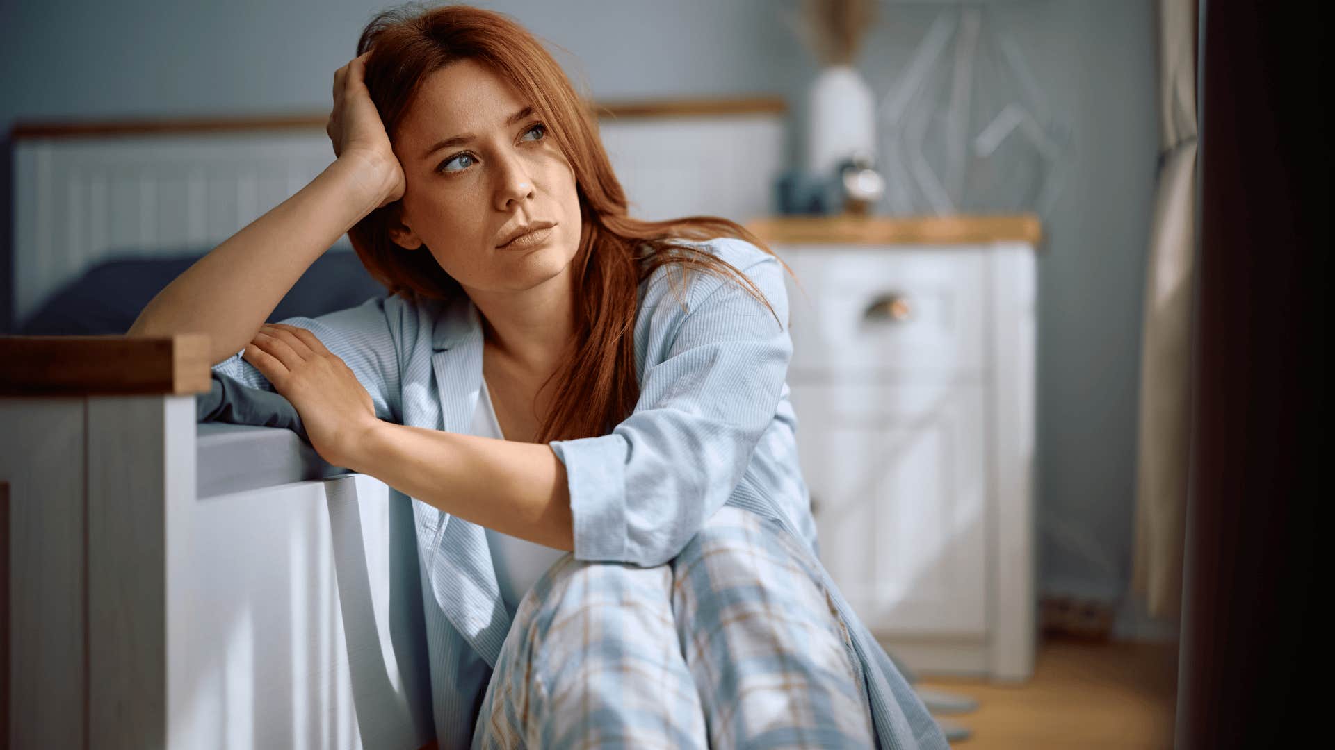 woman staring out the window as she thinks i've got a lot on my mind