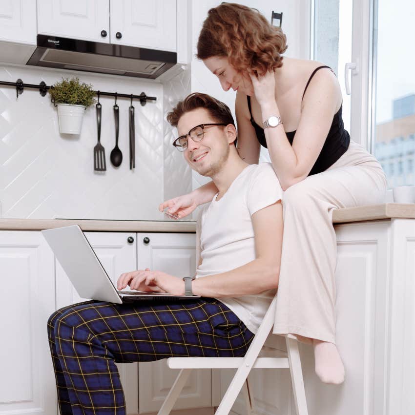 Millennial couple working remotely from home while balancing their careers with travel and personal time
