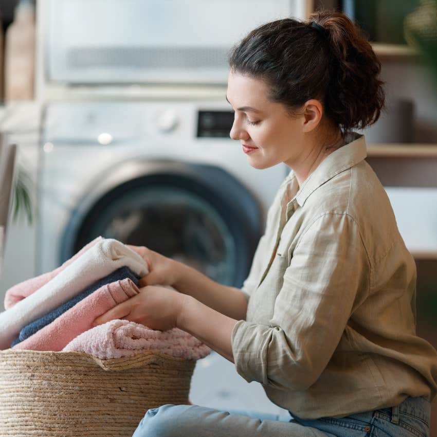 woman folding the laundry
