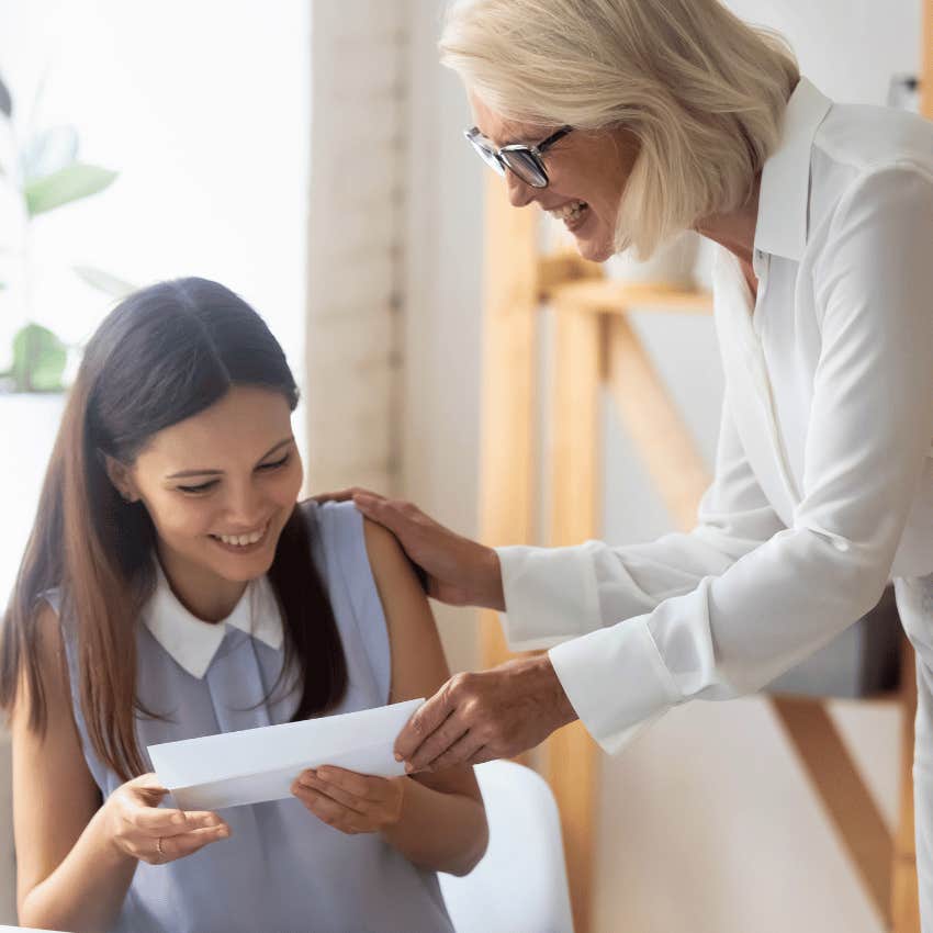 natural born leader praising young female employee