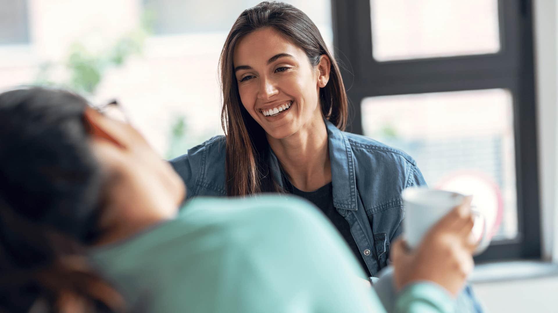 woman smiling at friend as she says i can work with that