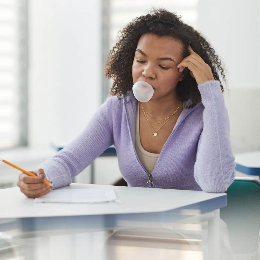 woman chewing gum noticing herself feeling stressed