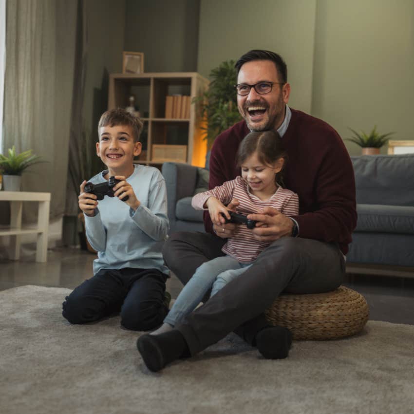 dad playing video games with kids who feel loved and accepted
